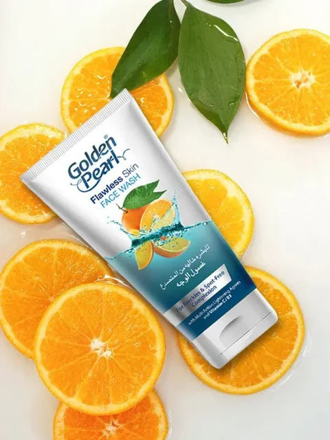 Golden Pearl Face Wash tube with oranges and leaves on a white background