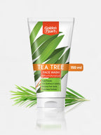 Golden Pearl Tea Tree Face Wash tube with green leaves on a white background