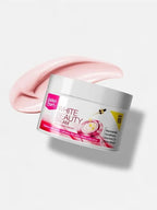 Jar of white beauty cream with pink cream smear on a light gray background