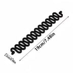 Black coiled spring with measurements on a white background