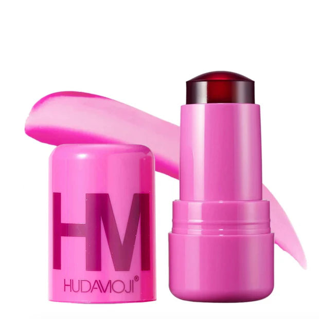 Pink makeup stick with 'HUDAMOJII' branding on a white background
