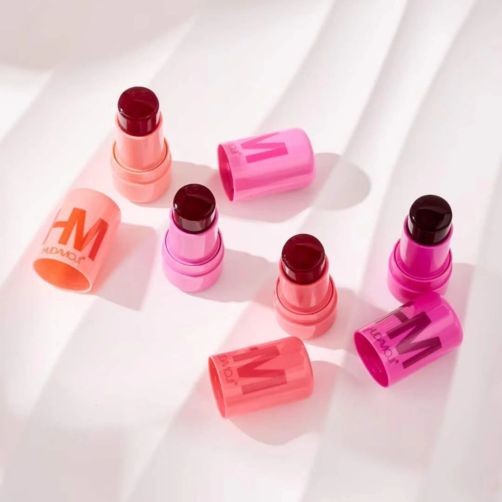 Pink lipsticks with visible brand logo on a white background