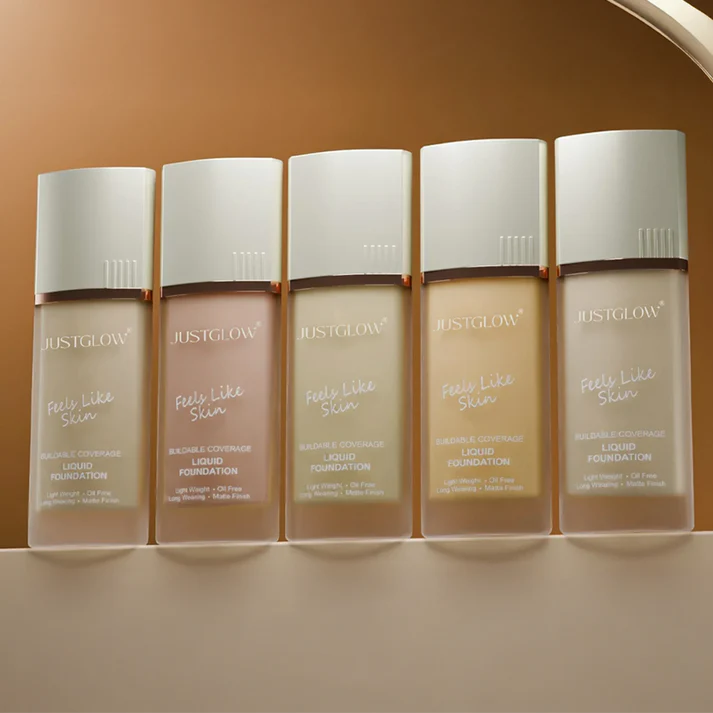 Five bottles of JustGlow Cosmetics Liquid Foundation