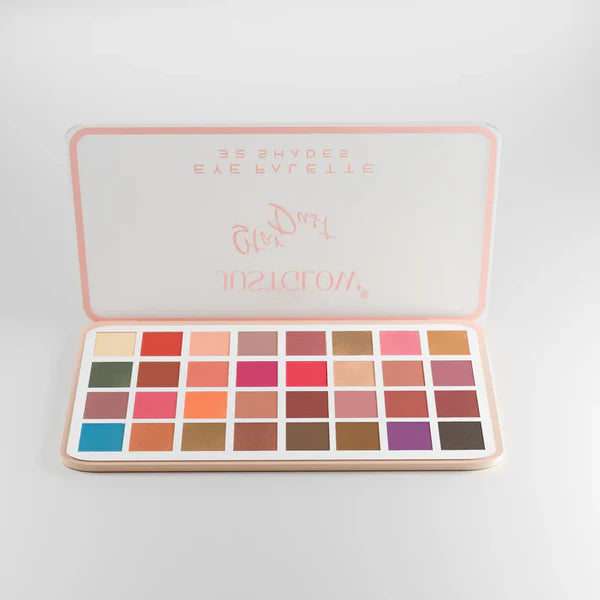 Makeup palette with various colors on a light gray background