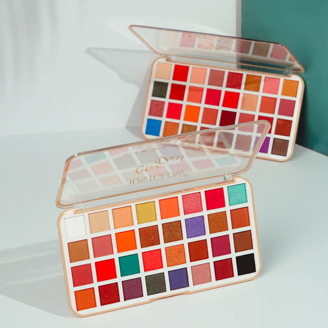 Makeup palette with colorful swatches on a light background