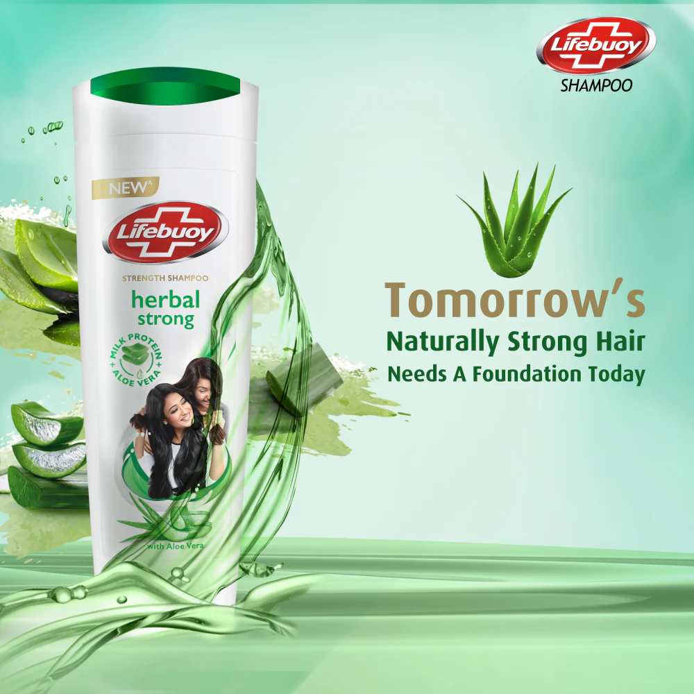 Lifebuoy herbal strong shampoo bottle with aloe vera leaves on a green background
