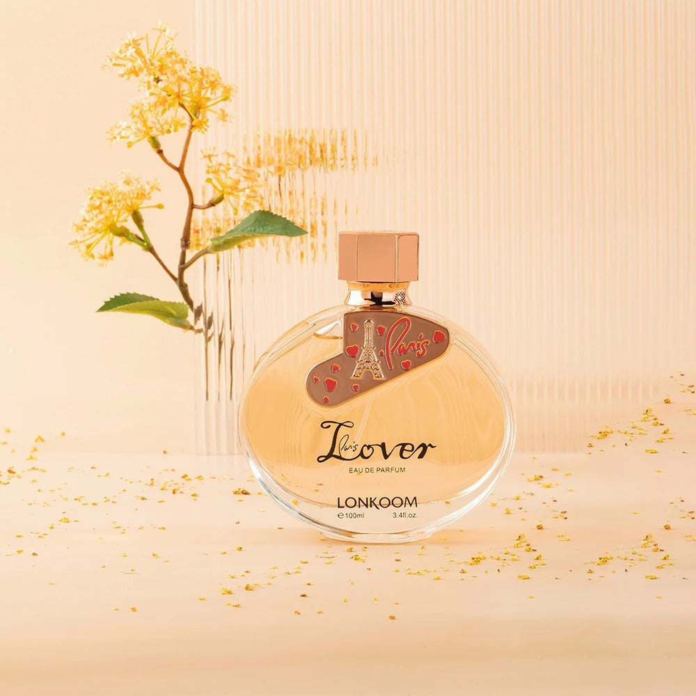 Perfume bottle labeled 'Lover' by LONKOOM with decorative elements on a beige background