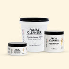 Three containers of MHOD's Facial Cleanser on a beige background