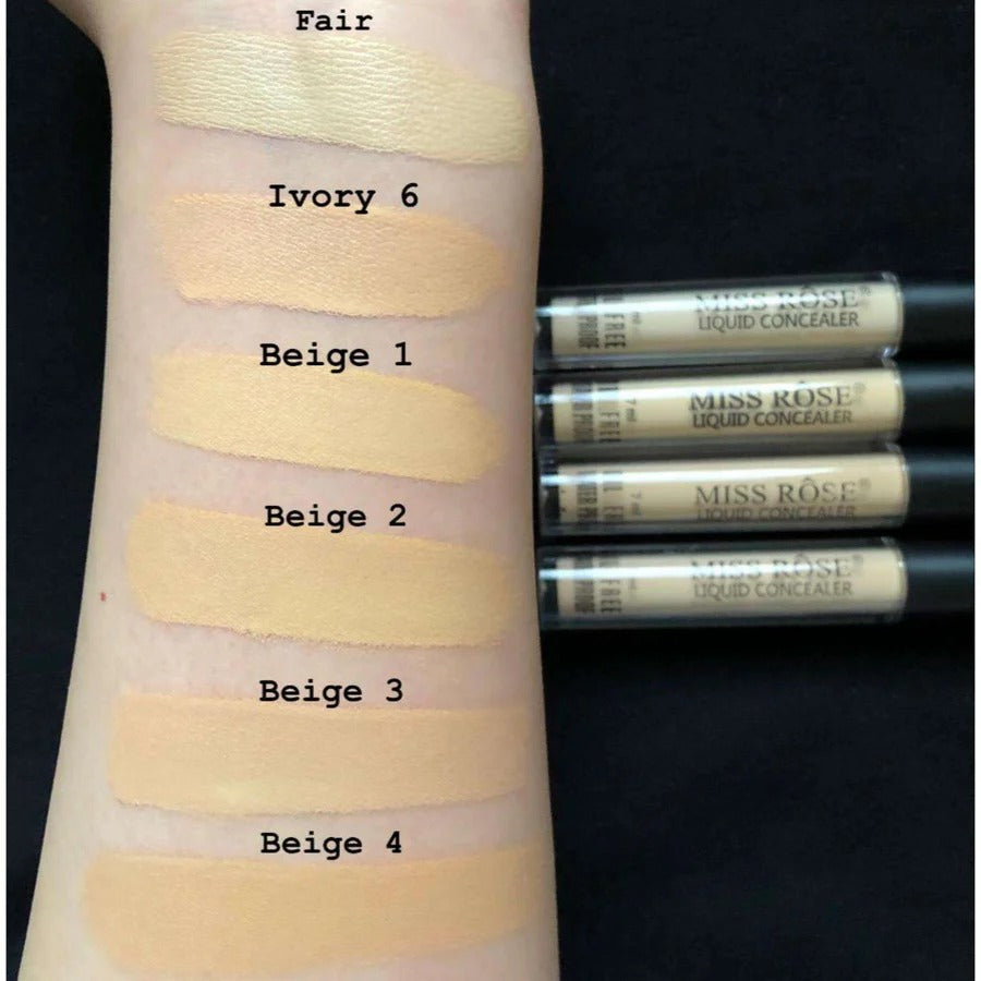 Concealer swatches on a arm with labeled shades and Miss Rose liquid concealer tubes.