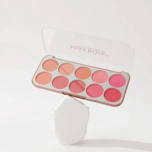 Makeup palette with pink and orange shades on a white background
