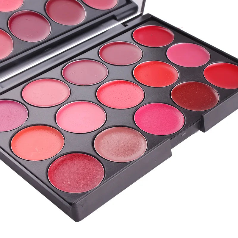 Makeup palette with pink and red shades on a white background