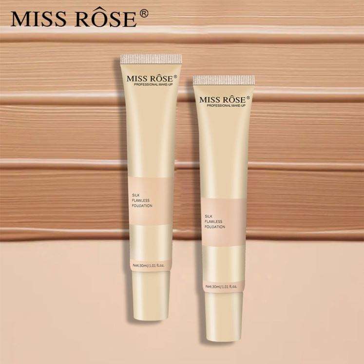 Two tubes of Miss Rose foundation on a wooden background