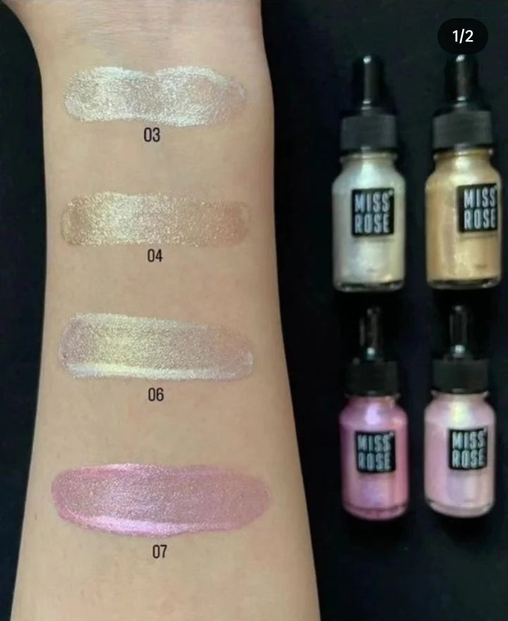 Miss Rose Professional Makeup High Beam Liquid Glitter Highlighter swatches on a arm with 'Miss Rose' products displayed.