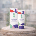 muéca skincare cream and packaging on a wooden surface with a blurred natural background