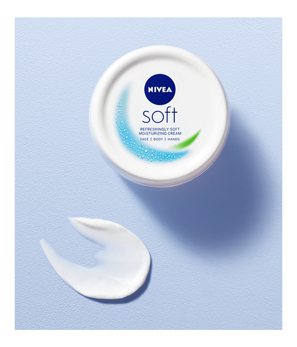 Nivea Soft cream jar with a swatch on a light blue background
