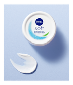 Nivea Soft cream jar with a swatch on a light blue background