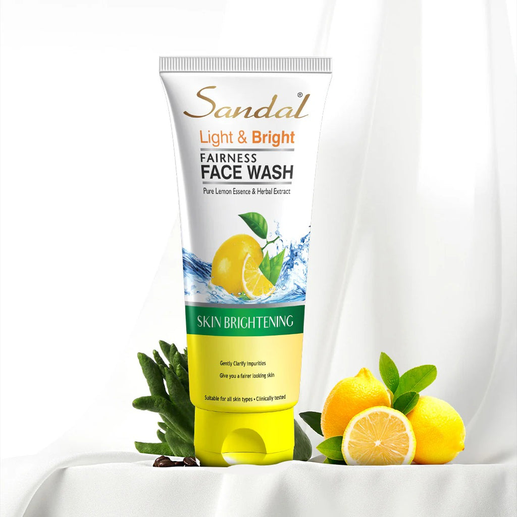 Sandal Light & Bright Fairness Face Wash tube with lemons and green leaves on a white background