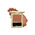 Compact blush with a brush on a white background