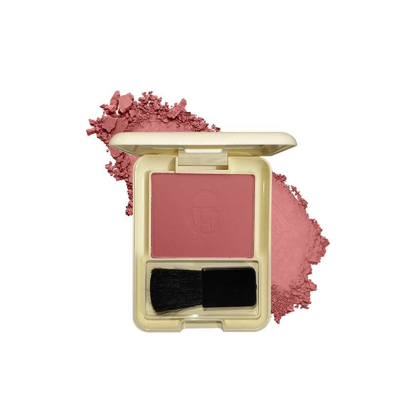 Makeup compact with pink blush, brush, and scattered blush on a white background