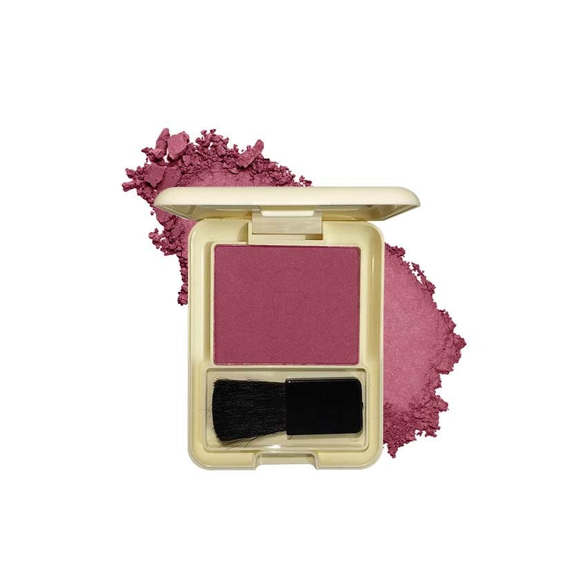 Compact blush with a brush and scattered powder on a white background