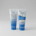 Two tubes of skin BIOTICS Anti Acne Face Wash on a marble surface.