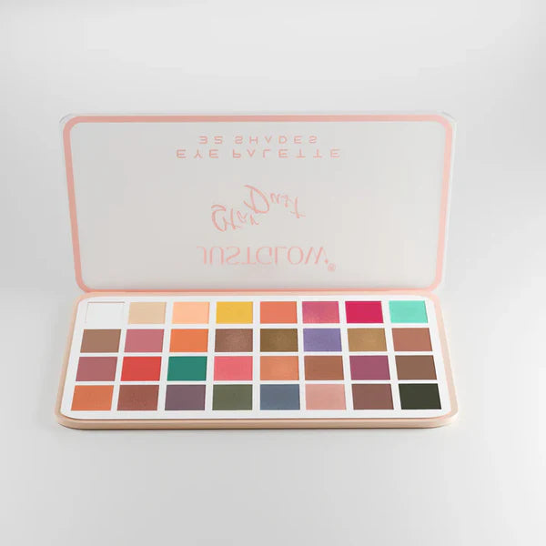 Makeup palette with various colors on a light gray background