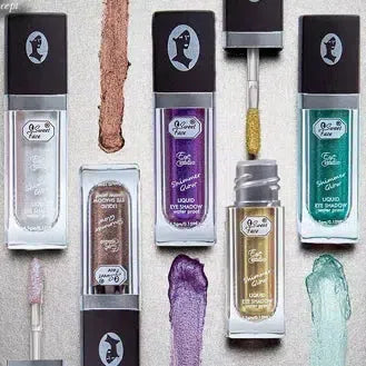 Set of makeup products with visible brand logo on a textured background