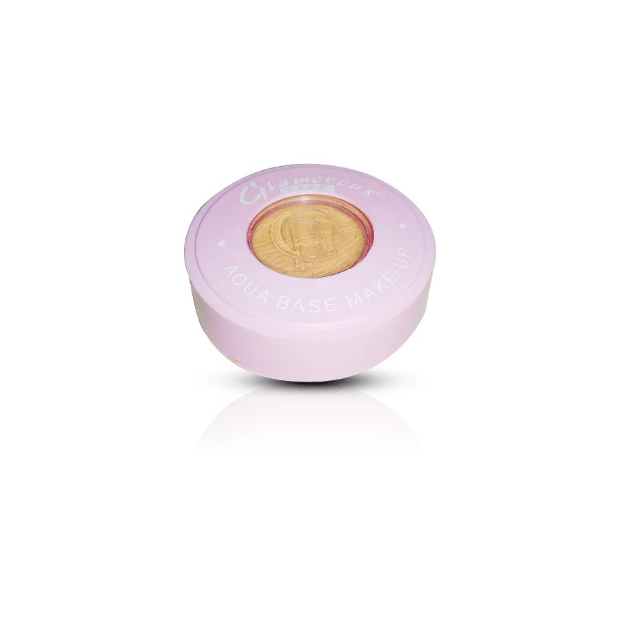 Pink cosmetic container with a gold lid on a white background