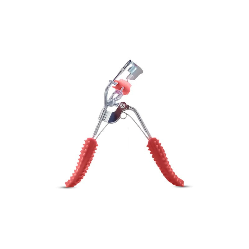 Eyelash curler with red silicone pads on a white background