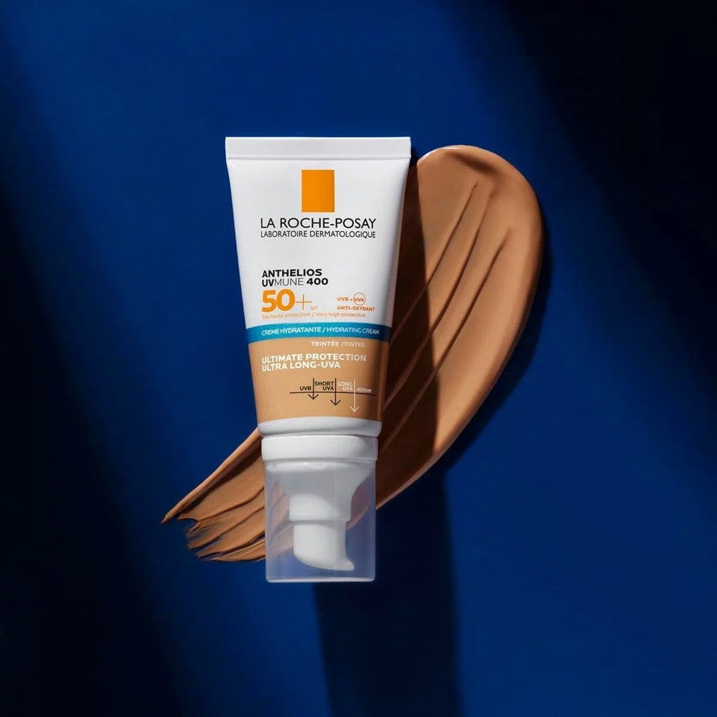 La Roche-Posay sunscreen tube with brown smear on a blue background