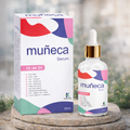 Muéeca serum packaging with dropper bottle on a stone surface